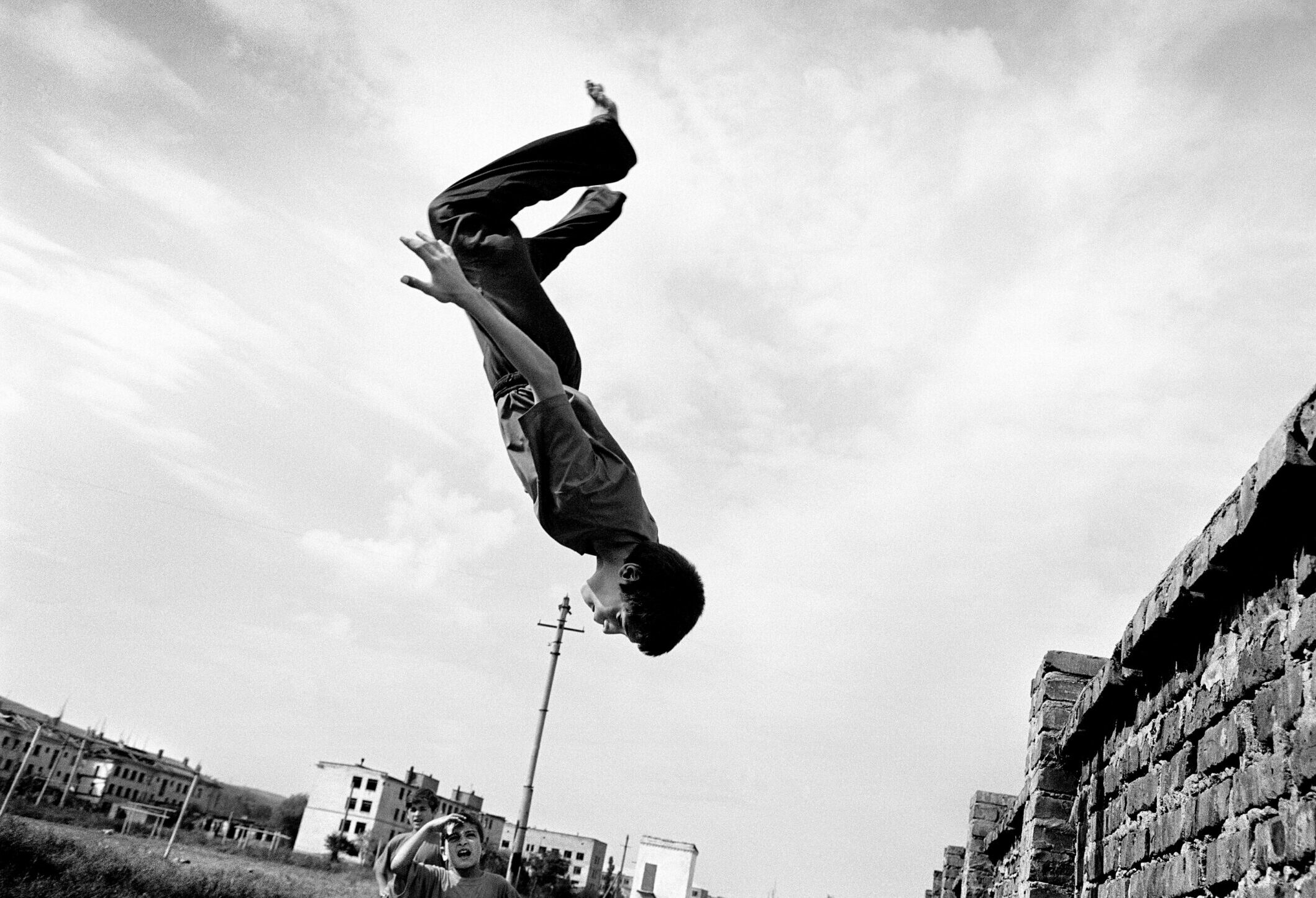 Boys play in the ruins of Grozny